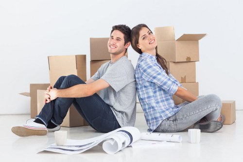 Worker using proper manual handling practices with a storage load