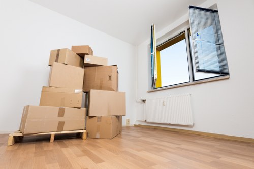 Professional movers handling local removals in Creekmouth near a property entrance