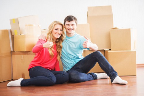 Local moving team handling boxes during removals in Creekmouth